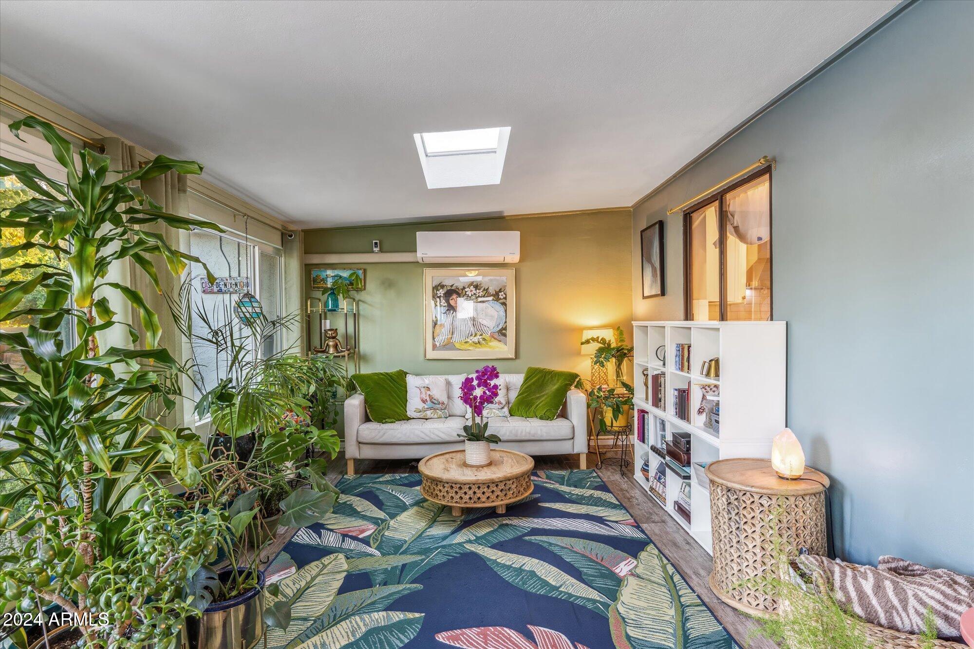 8019 North 7th Avenue Phoenix, AZ 85021 - Photo 21 of 43 a living room with furniture and a potted plant
