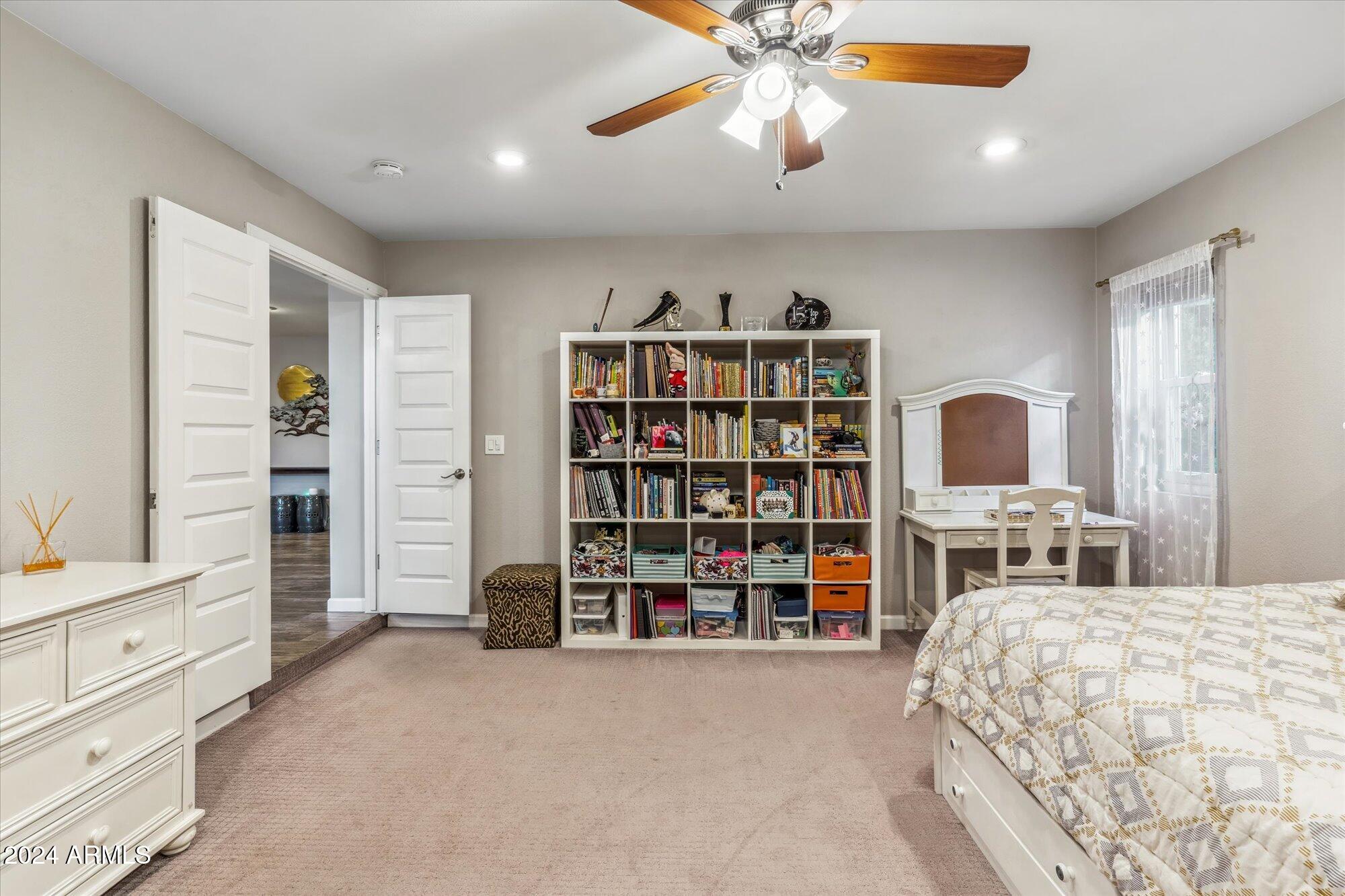 8019 North 7th Avenue Phoenix, AZ 85021 - Photo 23 of 43 a bedroom with a large bed and a chandelier