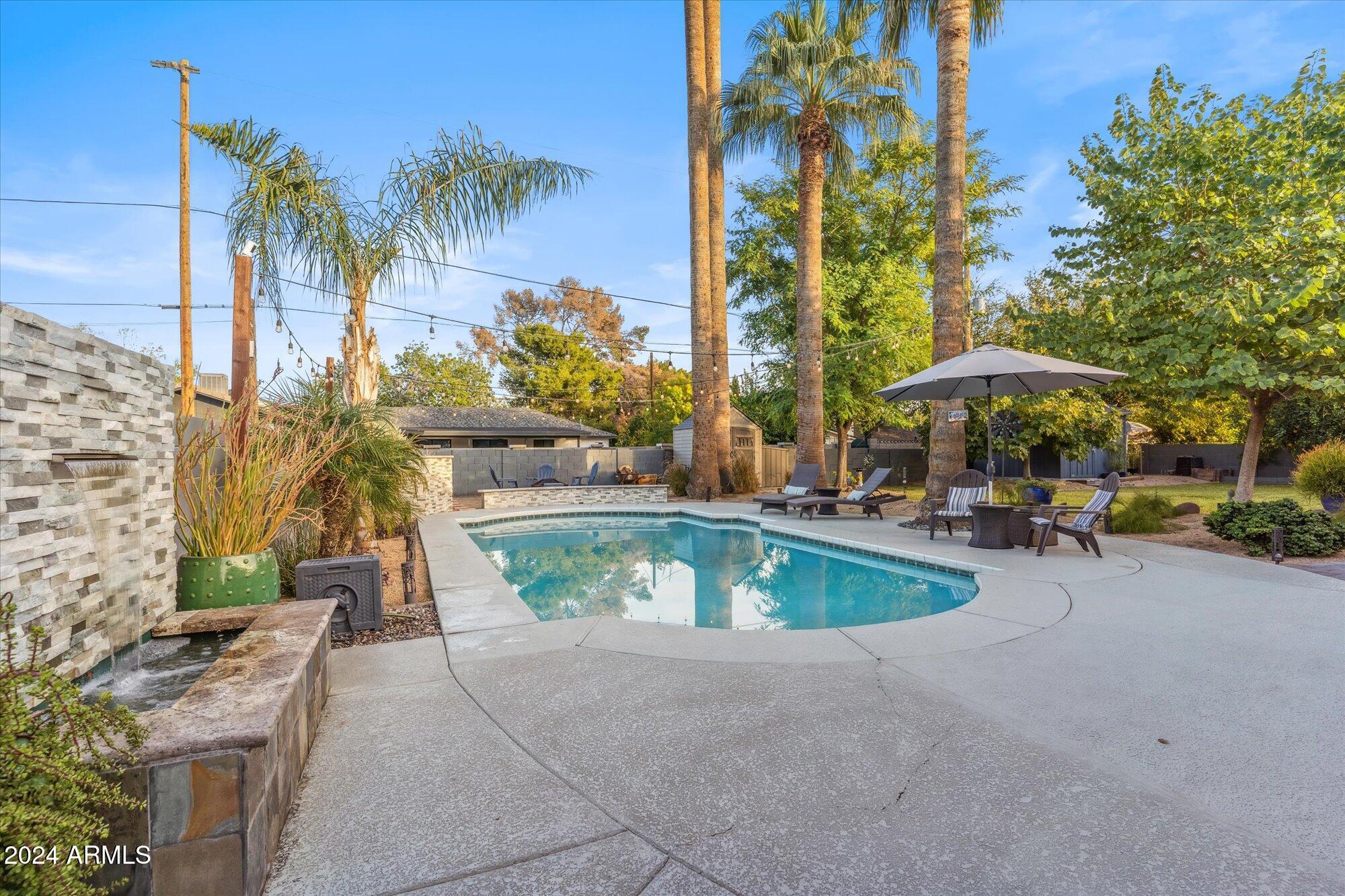 8019 North 7th Avenue Phoenix, AZ 85021 - Photo 37 of 43 a view of a swimming pool with chairs