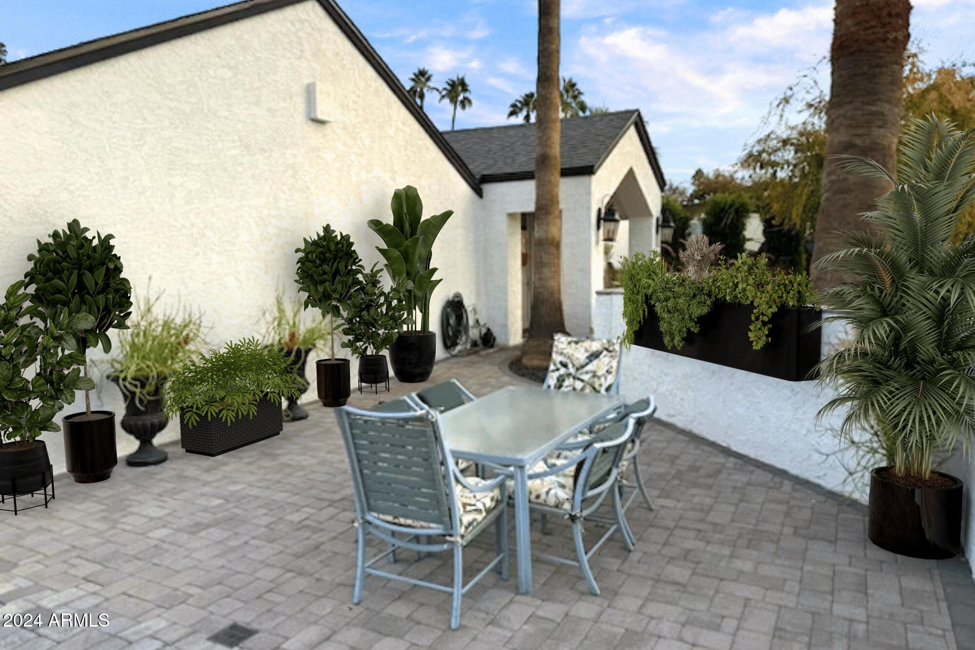 8019 North 7th Avenue Phoenix, AZ 85021 - Photo 4 of 43 a view of a dinning table and chairs in patio