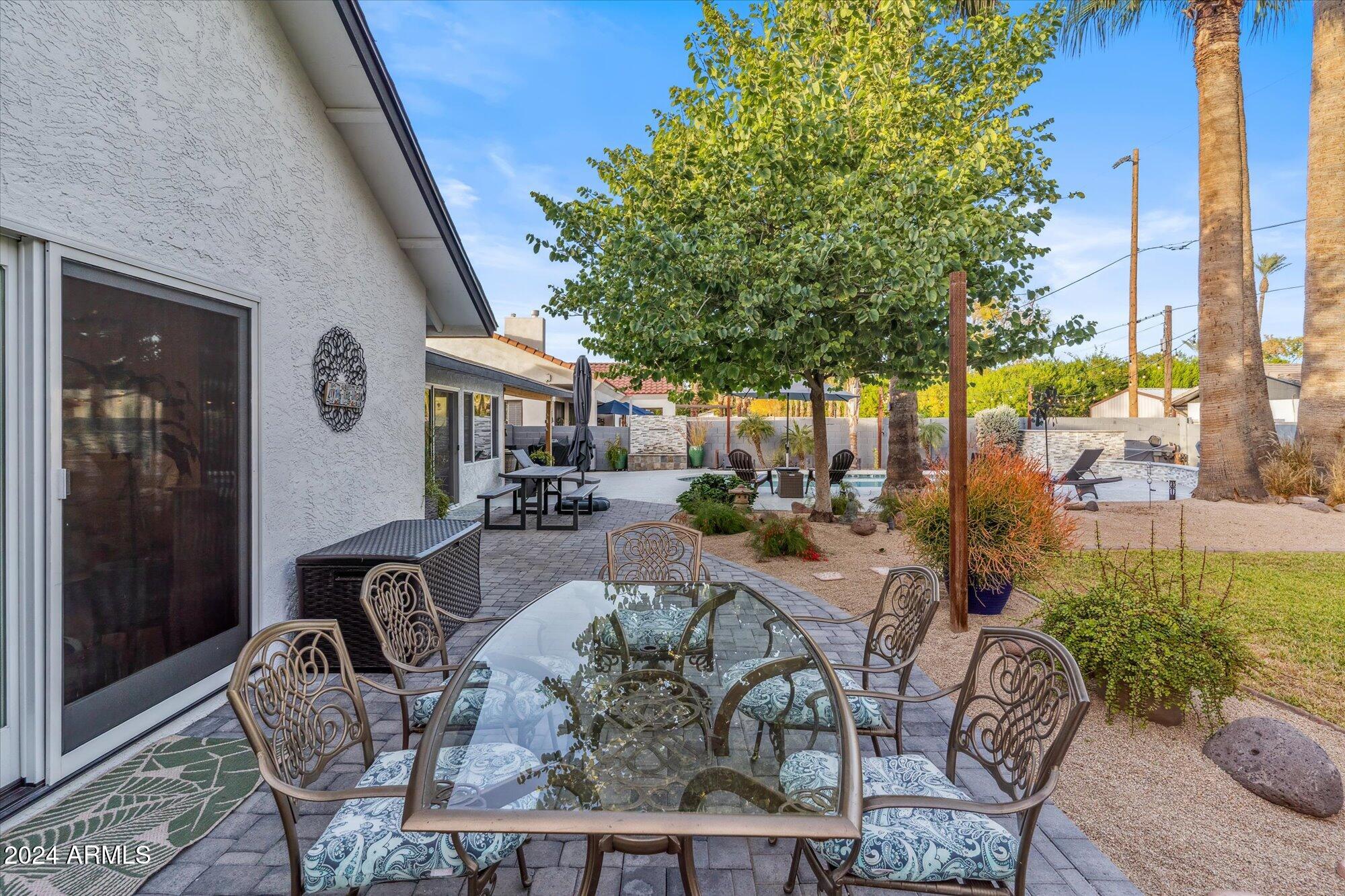 8019 North 7th Avenue Phoenix, AZ 85021 - Photo 41 of 43 a view of a patio with couches table and chairs and potted plants