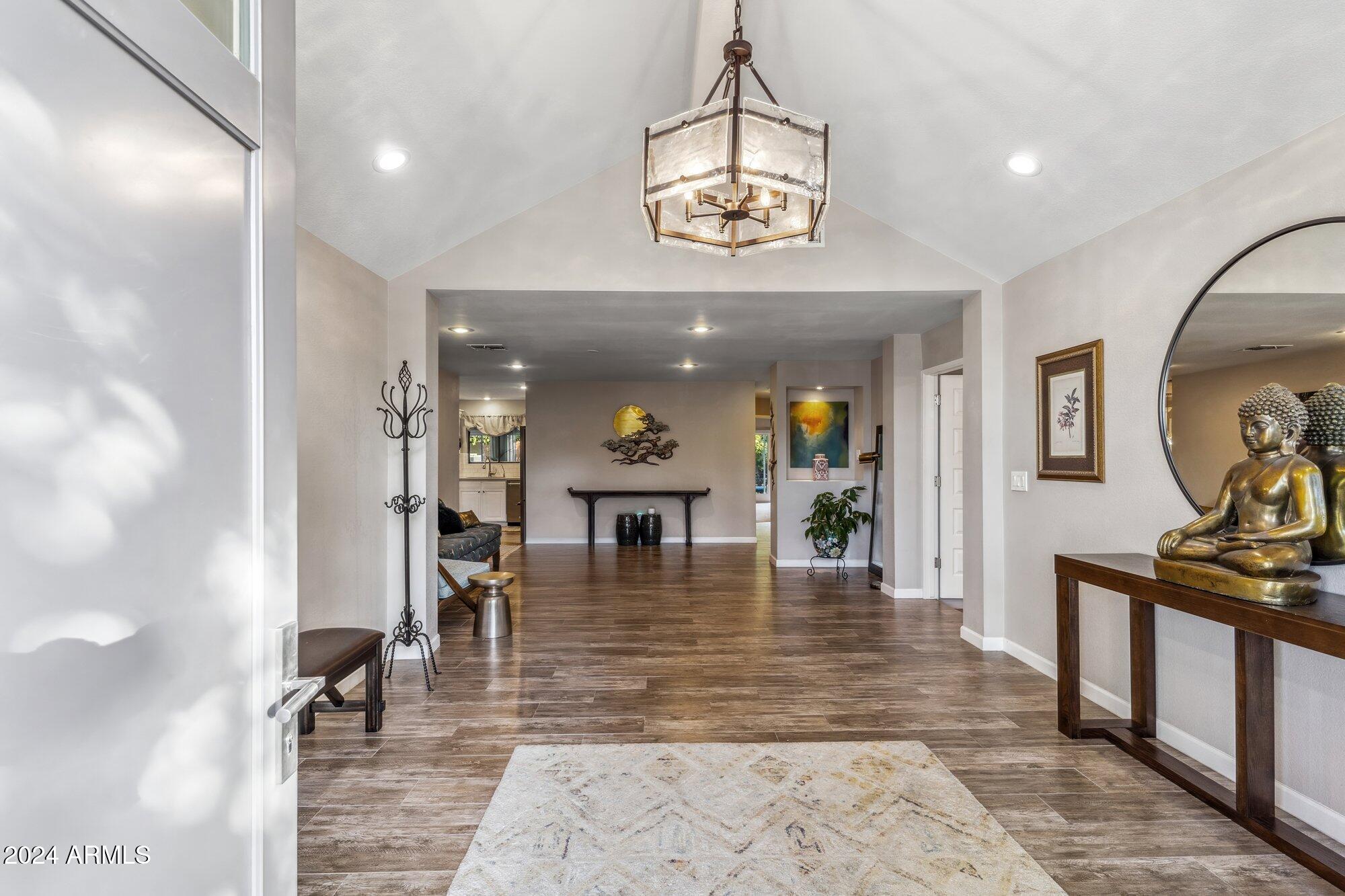 8019 North 7th Avenue Phoenix, AZ 85021 - Photo 5 of 43 an entryway a dining room and chandelier