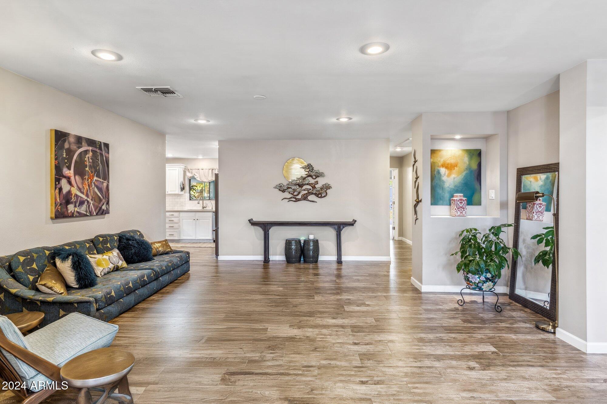 8019 North 7th Avenue Phoenix, AZ 85021 - Photo 7 of 43 a living room with furniture and a large window