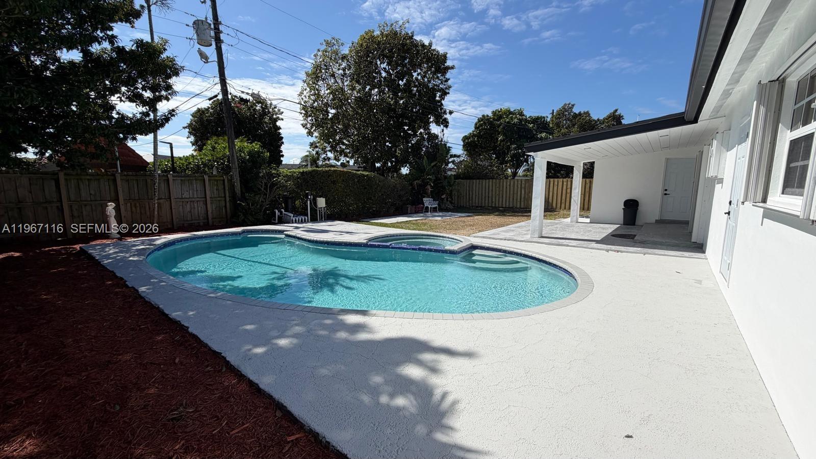9620 Southwest 9th Terrace Miami, FL 33174 - Photo 1 of 26 a view of a backyard with wooden fence