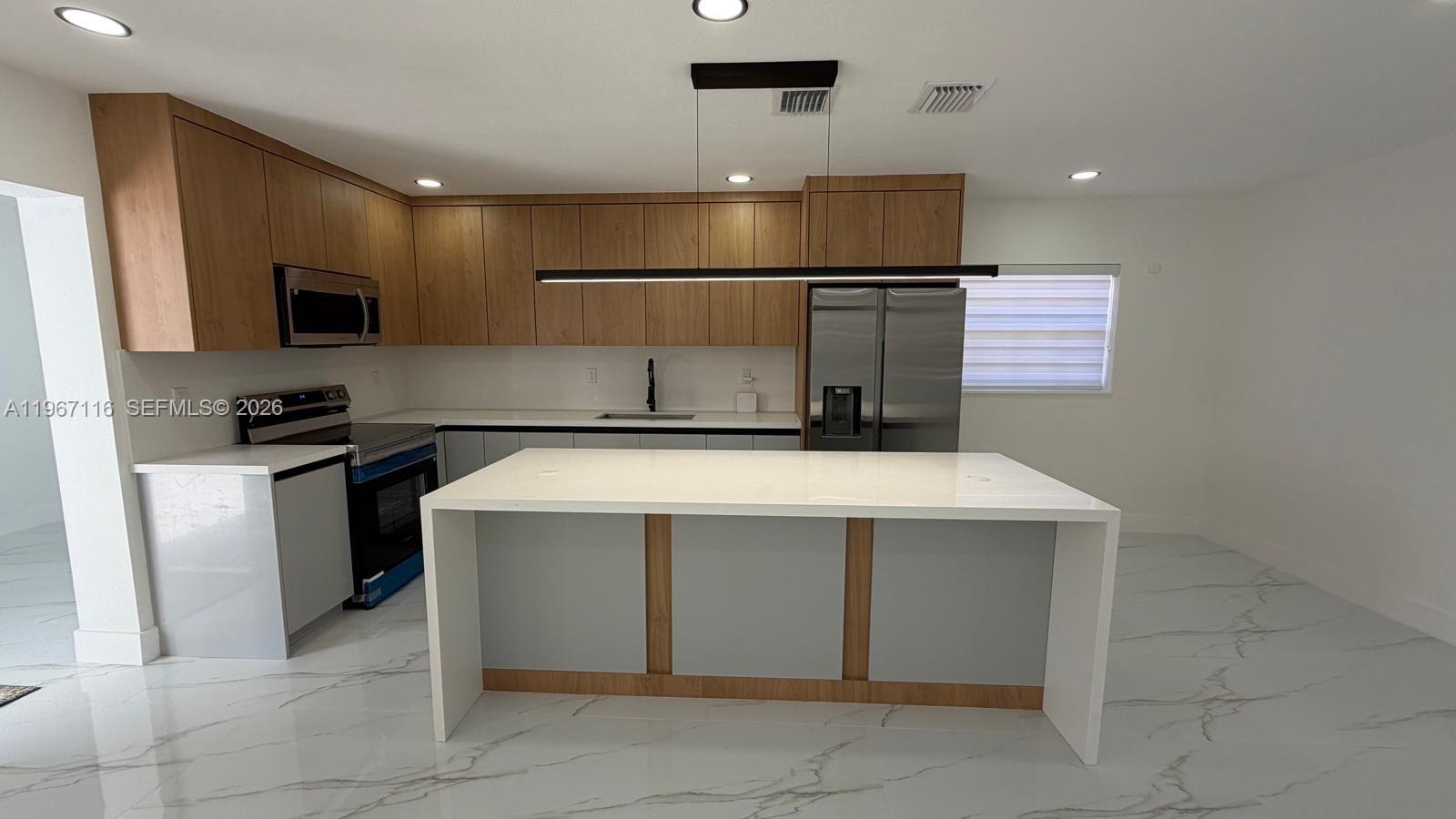 9620 Southwest 9th Terrace Miami, FL 33174 - Photo 15 of 26 a kitchen with a sink and cabinets