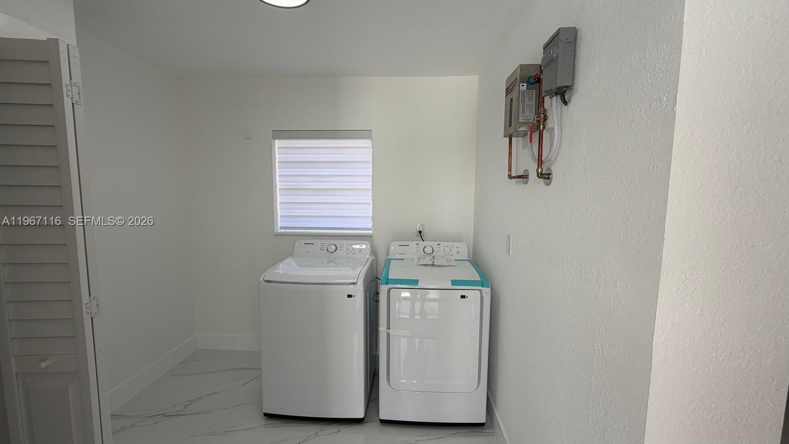 9620 Southwest 9th Terrace Miami, FL 33174 - Photo 20 of 26 a utility room with dryer and washer