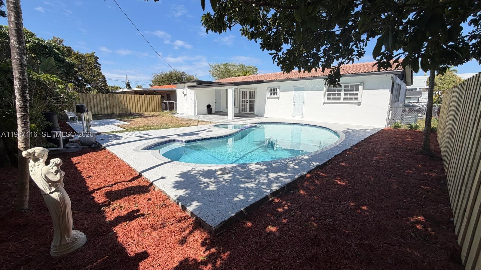 9620 Southwest 9th Terrace Miami, FL 33174 - Photo 2 of 26 swimming pool view with a seating space