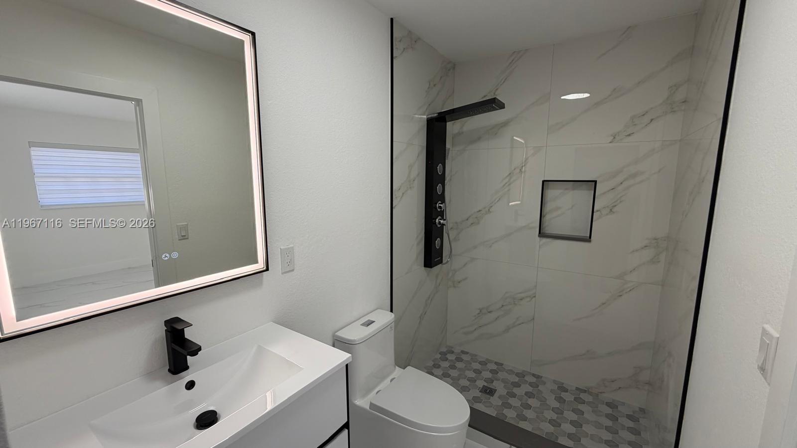 9620 Southwest 9th Terrace Miami, FL 33174 - Photo 5 of 26 a bathroom with a sink a toilet and shower