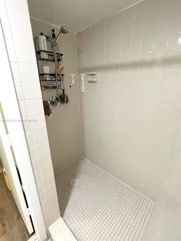 a bathroom with a sink and a shower