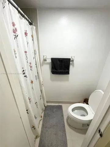 a bathroom with a toilet a sink and a bathtub