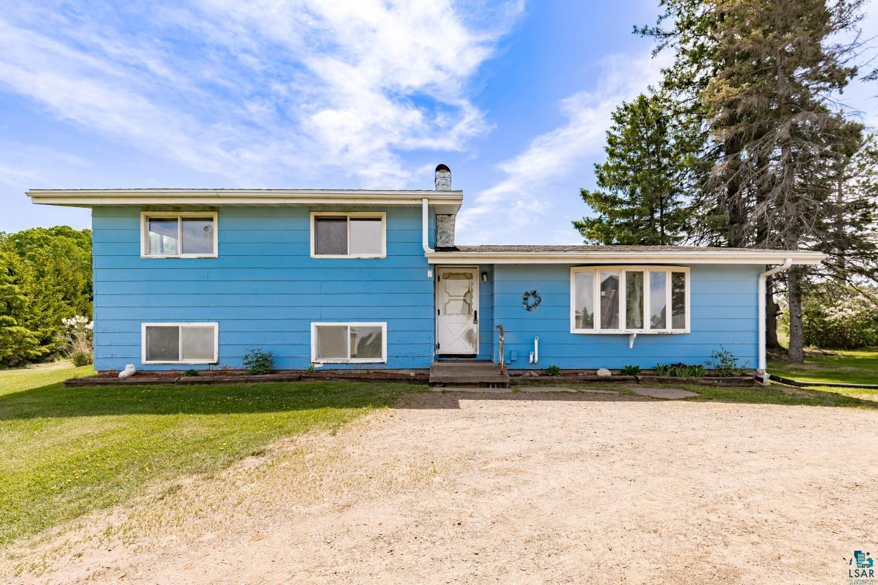 6606 Metso Road Kettle River, MN 55757 - Photo 52 of 84 Two-story residence featuring blue siding, white trim, and a prominent bay window
