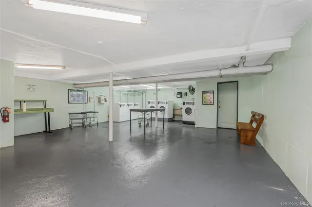 a view of a livingroom with furniture and hardwood floor