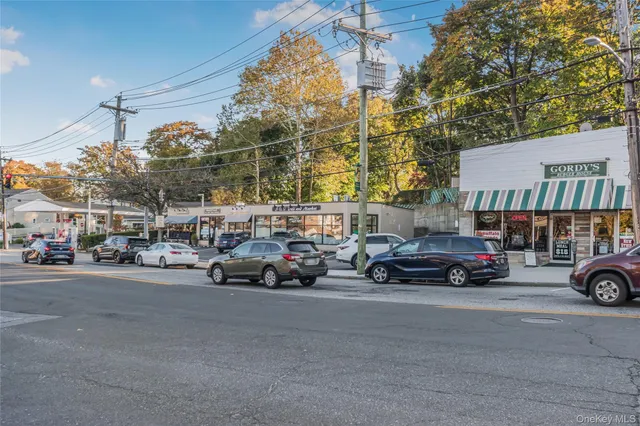 a view of a cars is parked in front of a building