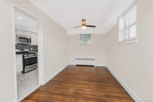 a view of a kitchen from the hallway