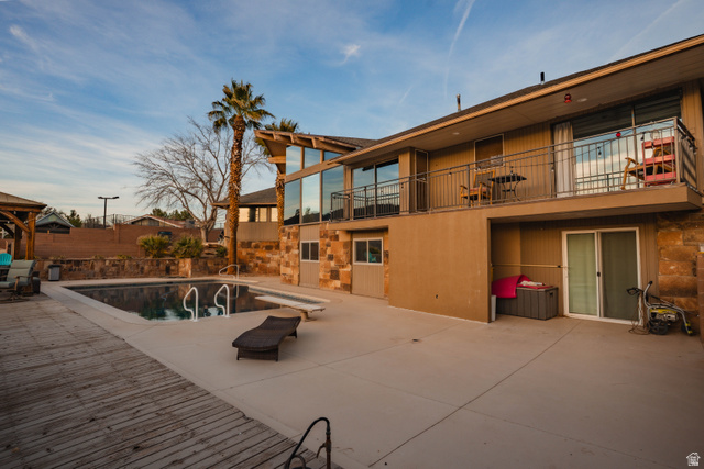 980 Cactus Circle St. George, UT 84790 - Photo 59 of 77 View of swimming pool with a balcony and patio surround
