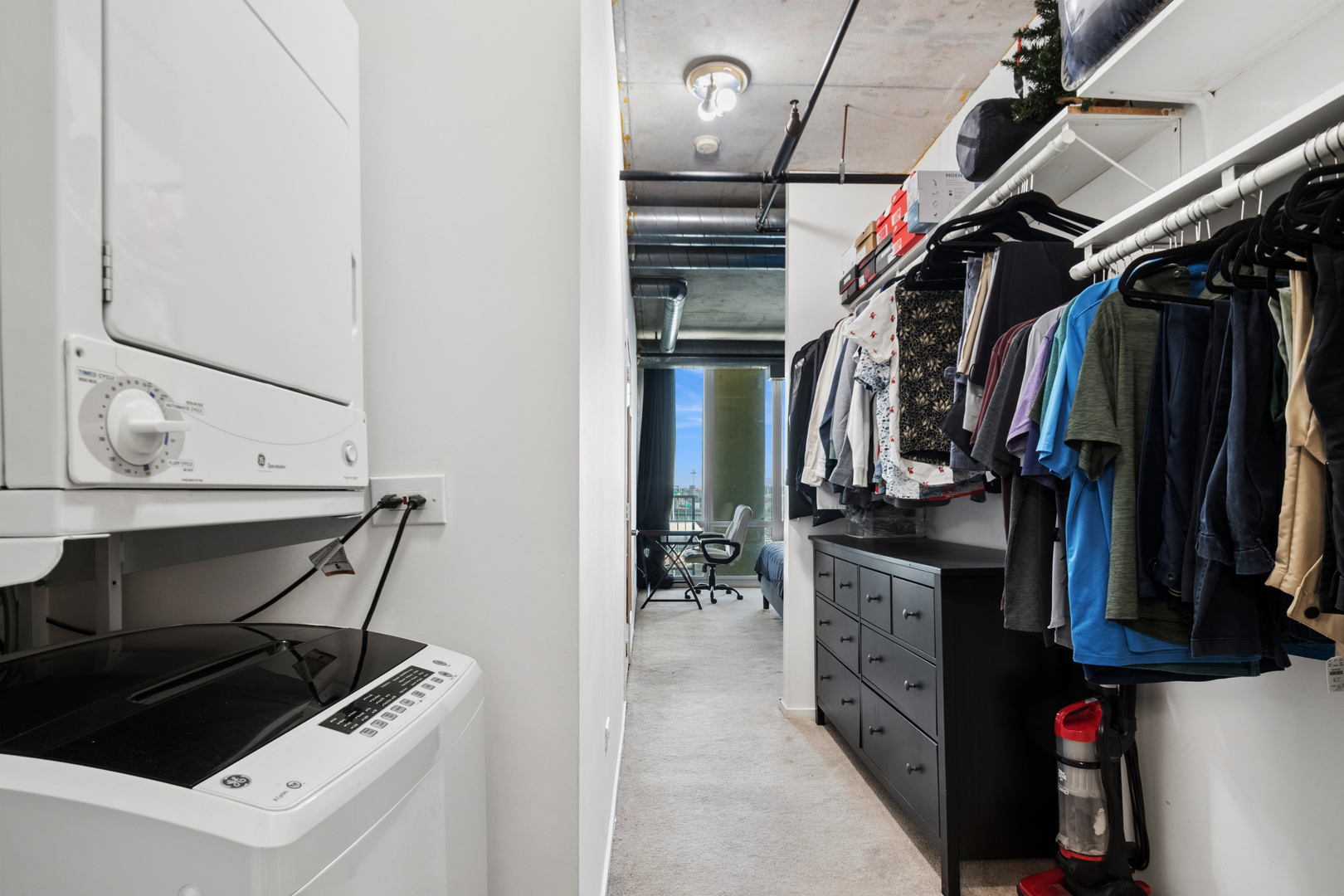 700 West Van Buren Street, Unit 1105 Chicago, IL 60607 - Photo 14 of 19 a view of walk in closet with clothes and shoes