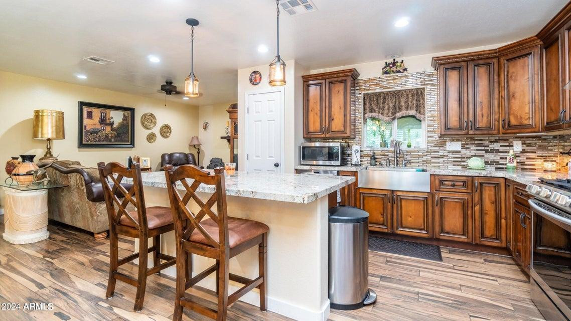 1011 West Northern Avenue Phoenix, AZ 85021 - Photo 11 of 25 a large kitchen with lots of counter space and windows
