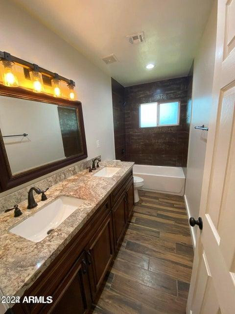 1011 West Northern Avenue Phoenix, AZ 85021 - Photo 13 of 25 a bathroom with a sink and a mirror