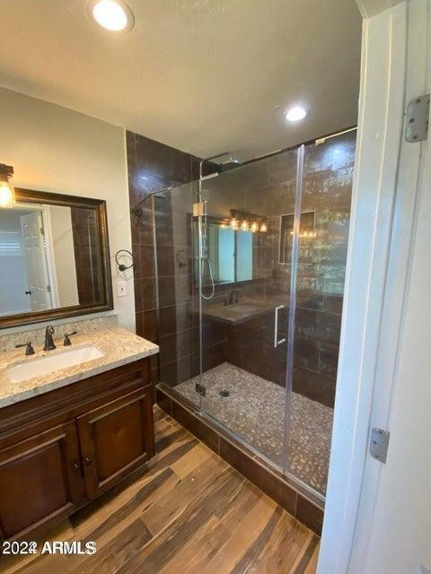 1011 West Northern Avenue Phoenix, AZ 85021 - Photo 18 of 25 a bathroom with a sink and a mirror