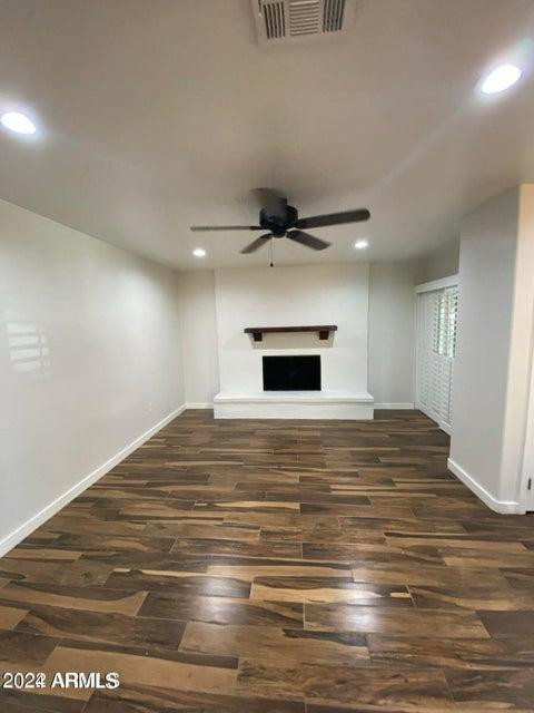 1011 West Northern Avenue Phoenix, AZ 85021 - Photo 3 of 25 a bedroom with a bed and a ceiling fan