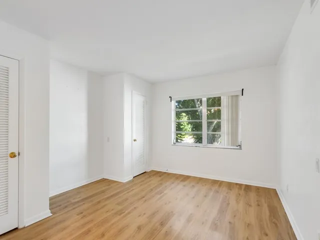 a bathroom with a toilet a sink and a mirror