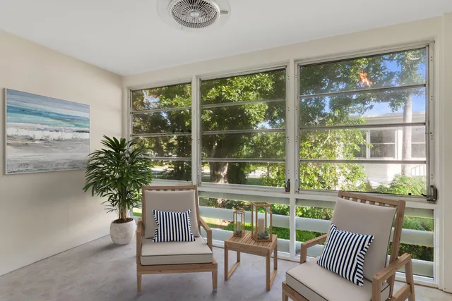 a view of a room with furniture and a porch