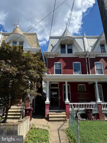 a front view of a building with retail shops