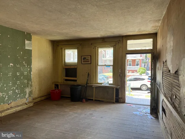 a kitchen with a refrigerator and a sink