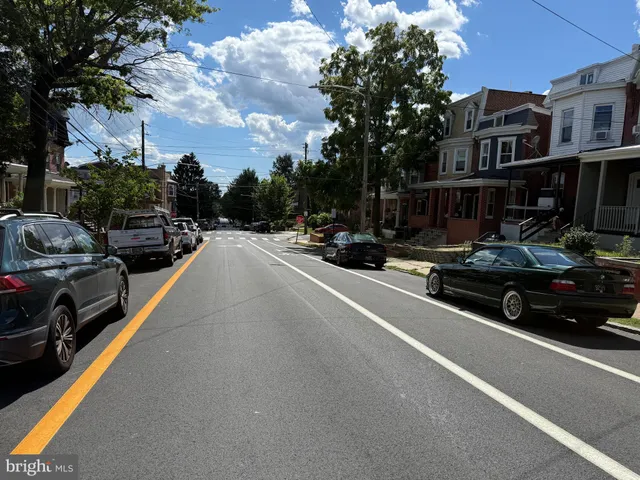 a view of a street with cars