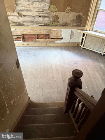 a kitchen with a sink cabinets and window
