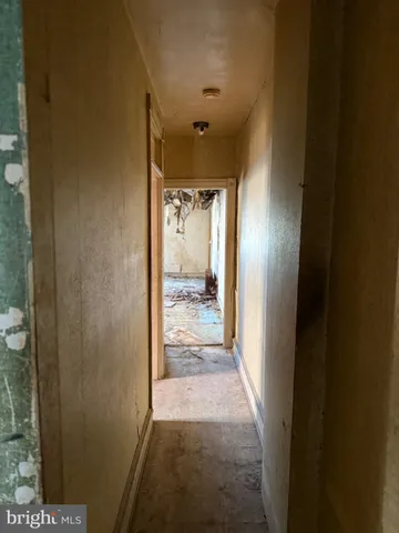 a front view of a building with a garden