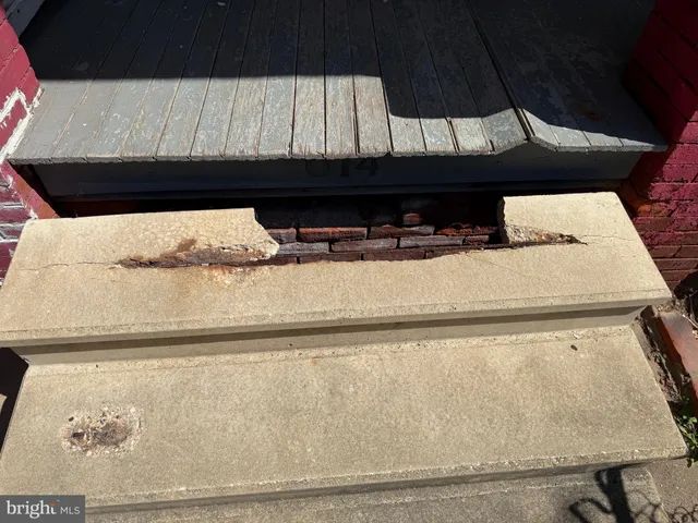 a view of an empty room with a fireplace