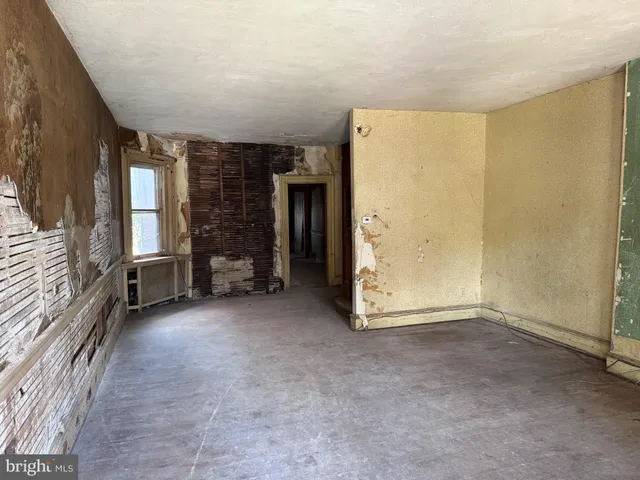 a view of entryway with wooden floor and stairs