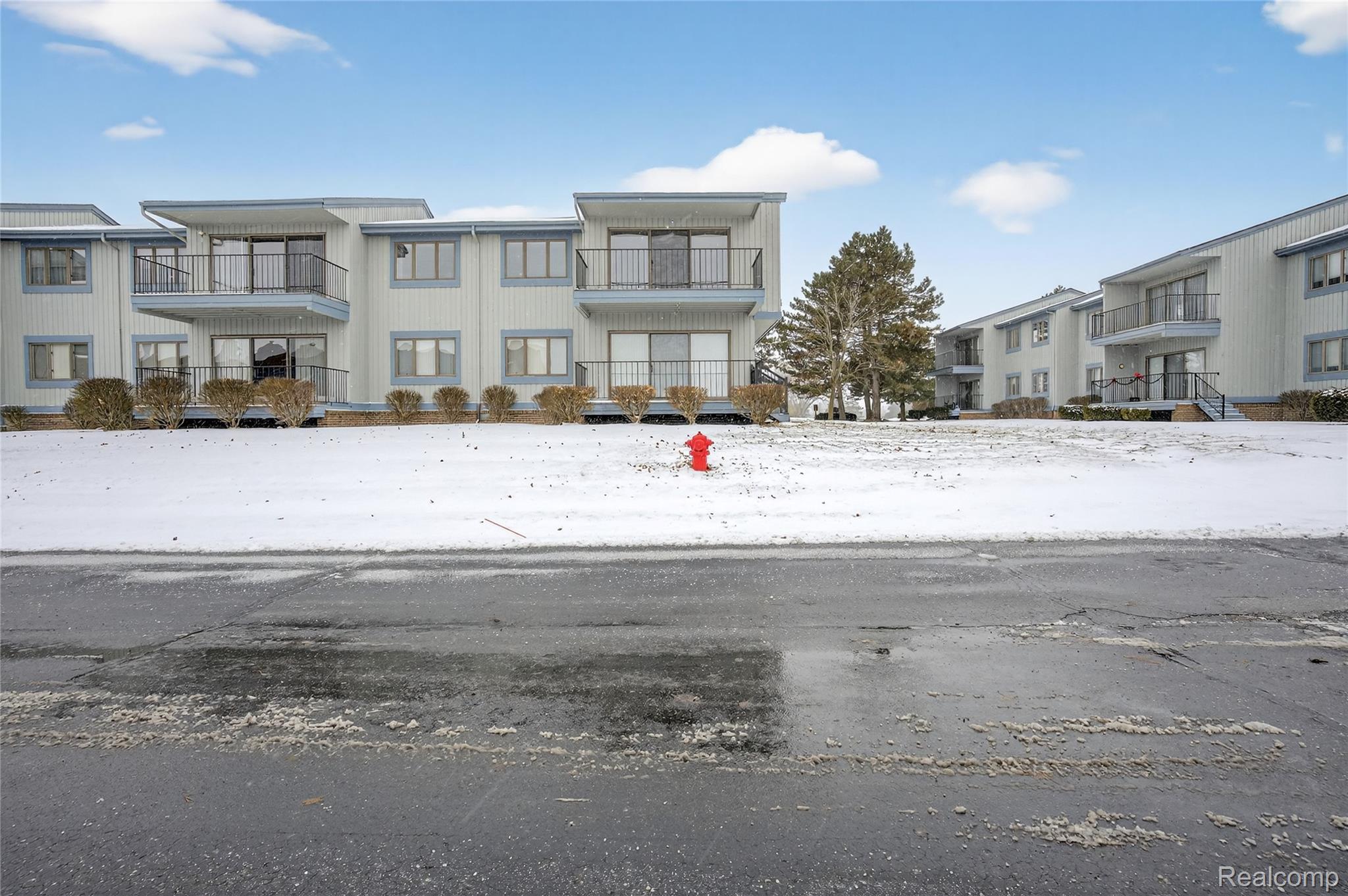 1715 River Road, Unit 77 St. Clair, MI 48079 - Photo 54 of 59 View of front of house featuring a balcony