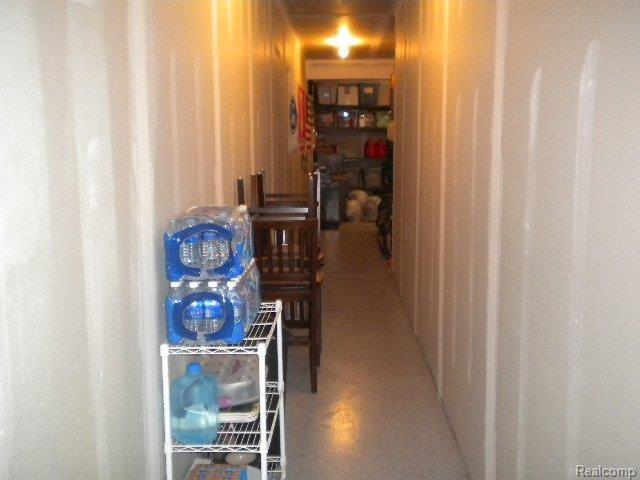 10225 Crossview Trail Howell, MI 48855 - Photo 4 of 17 Garage Hallway Storage.jpg