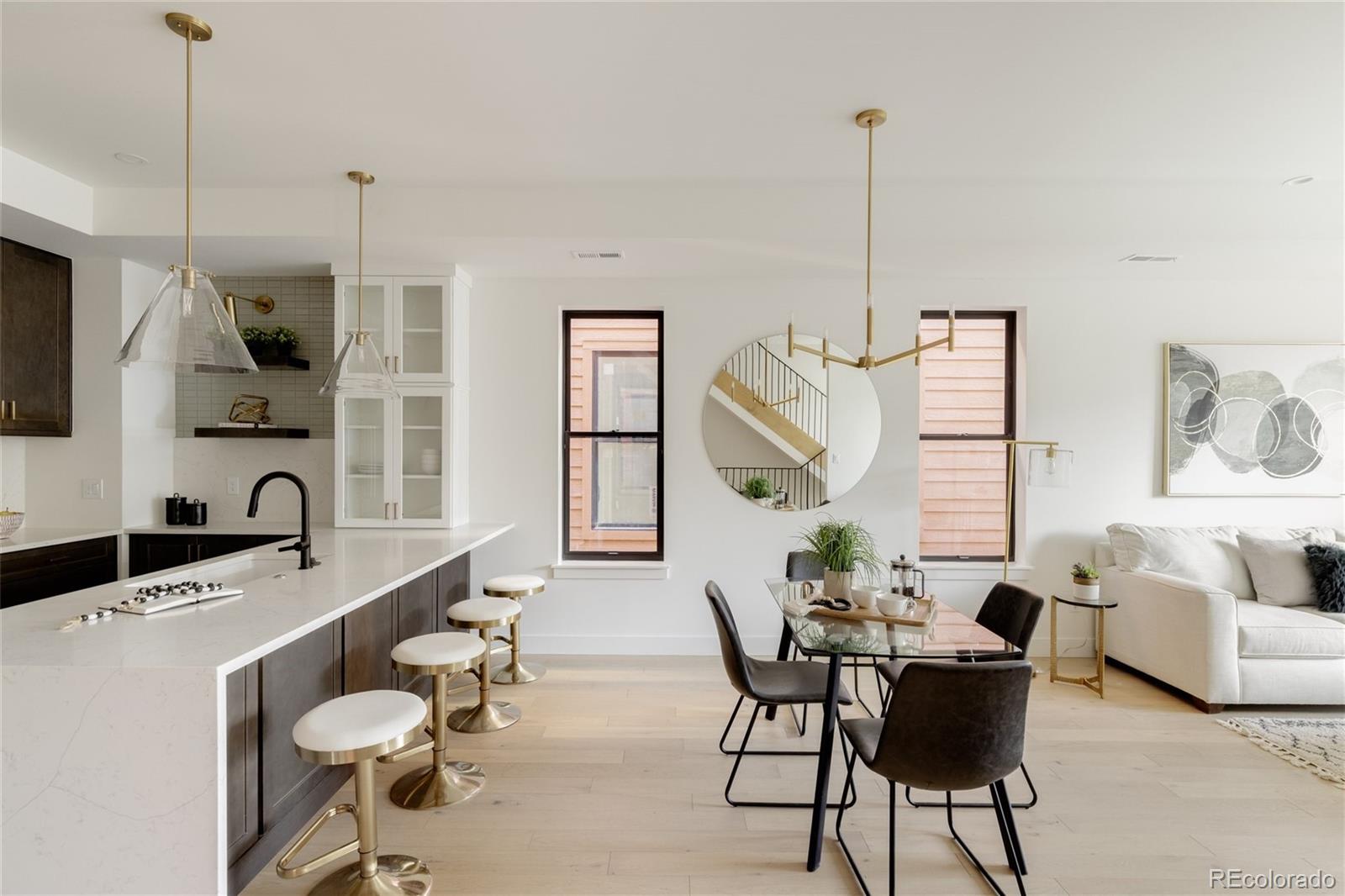 1749 North Williams Street, Unit 2 Denver, CO 80218 - Photo 11 of 34 a living room with furniture a large window and a chandelier