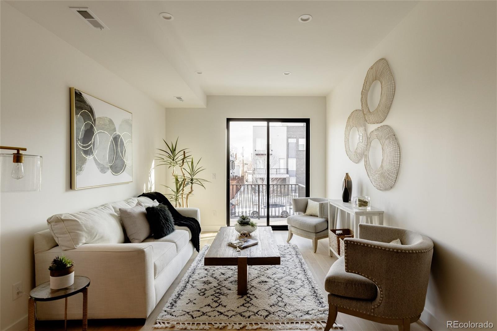 1749 North Williams Street, Unit 2 Denver, CO 80218 - Photo 13 of 34 a living room with furniture and a large window