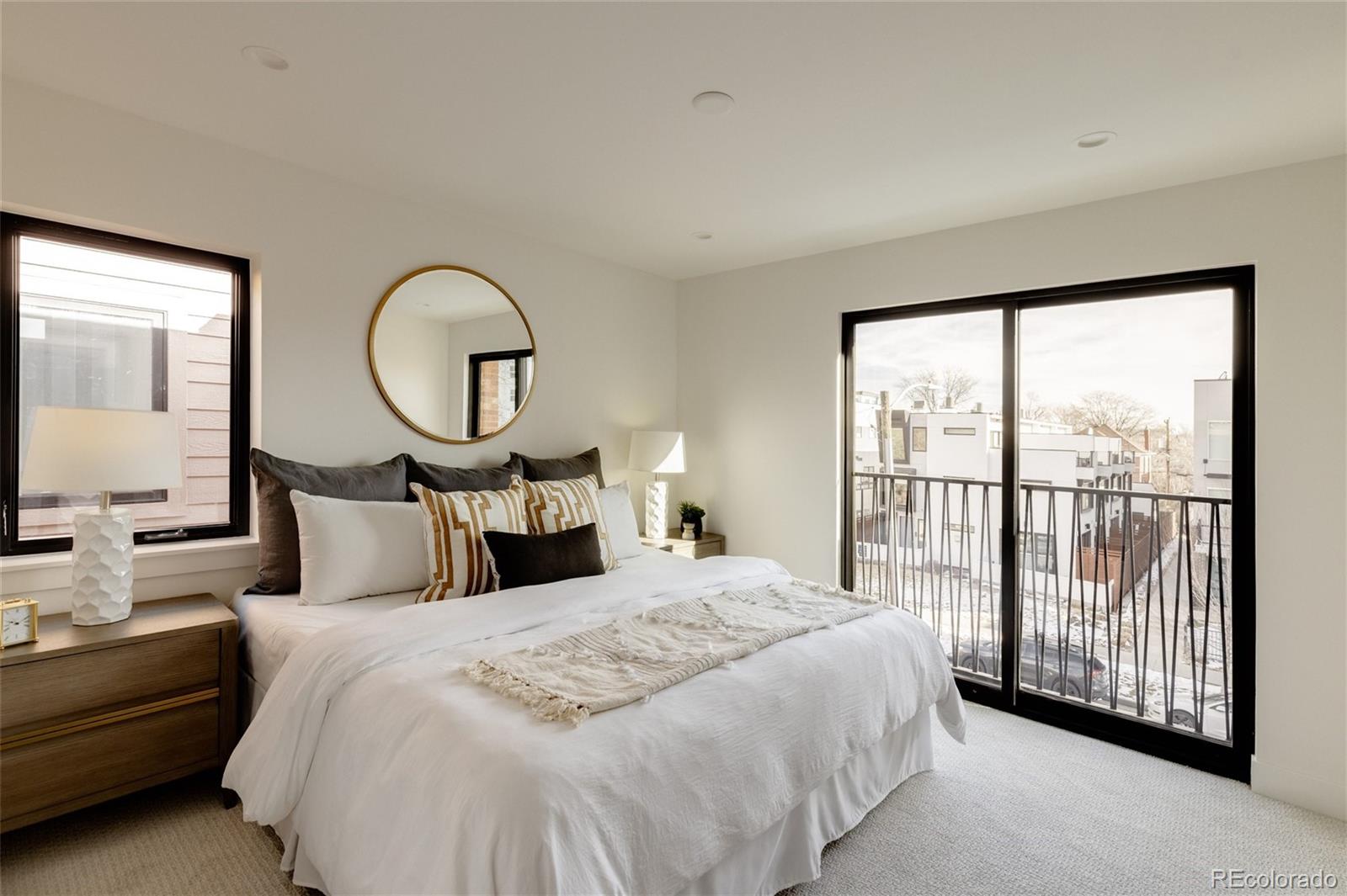 1749 North Williams Street, Unit 2 Denver, CO 80218 - Photo 17 of 34 a bed room with a bed and a large window