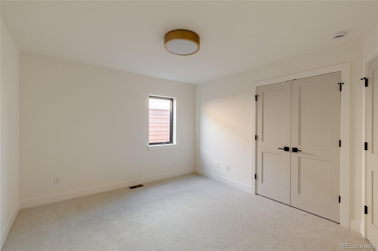 1749 North Williams Street, Unit 2 Denver, CO 80218 - Photo 22 of 34 a view of an empty room with a window