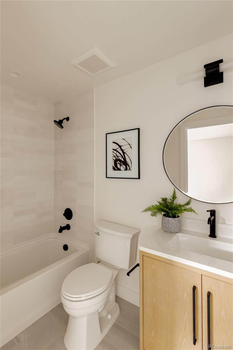1749 North Williams Street, Unit 2 Denver, CO 80218 - Photo 23 of 34 a bathroom with a sink a toilet and shower