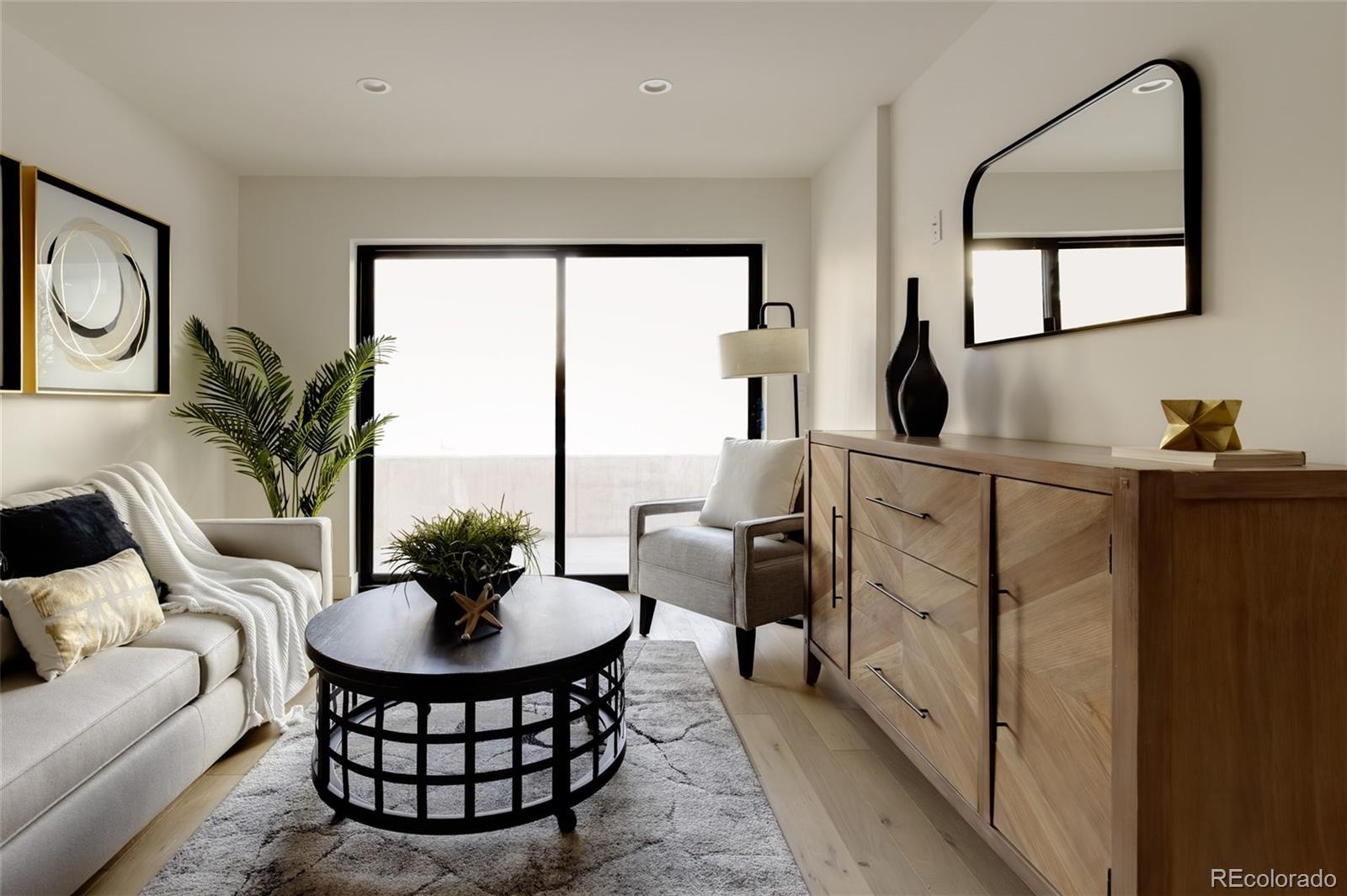 1749 North Williams Street, Unit 2 Denver, CO 80218 - Photo 27 of 34 a living room with furniture a rug a lamp and a large window