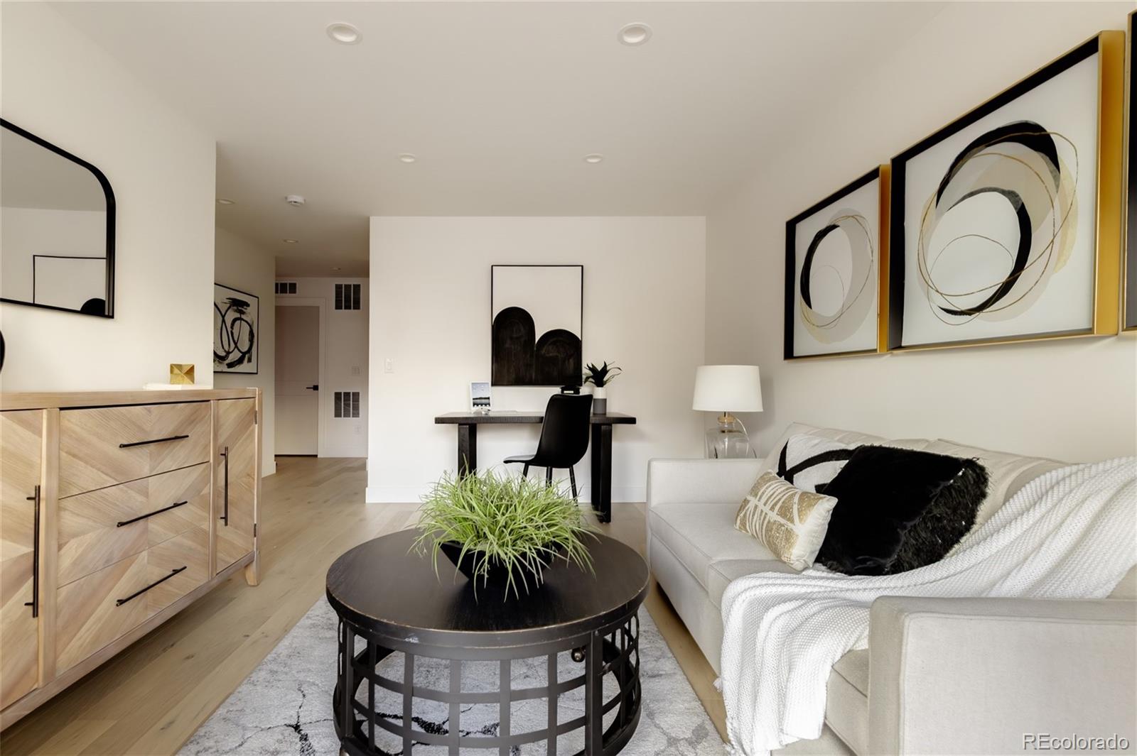 1749 North Williams Street, Unit 2 Denver, CO 80218 - Photo 28 of 34 a living room with furniture and a mirror