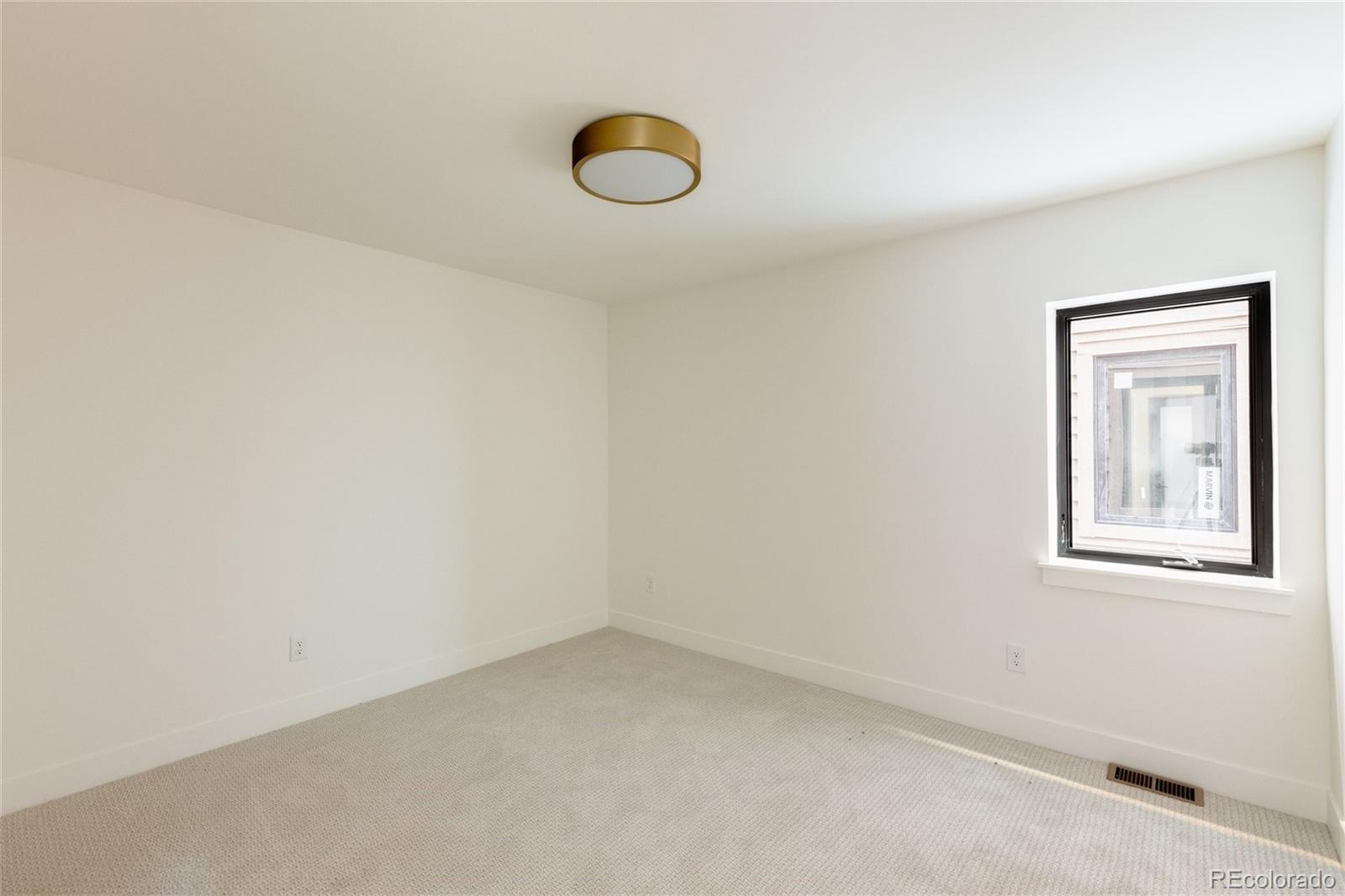 1749 North Williams Street, Unit 2 Denver, CO 80218 - Photo 29 of 34 an empty room with windows