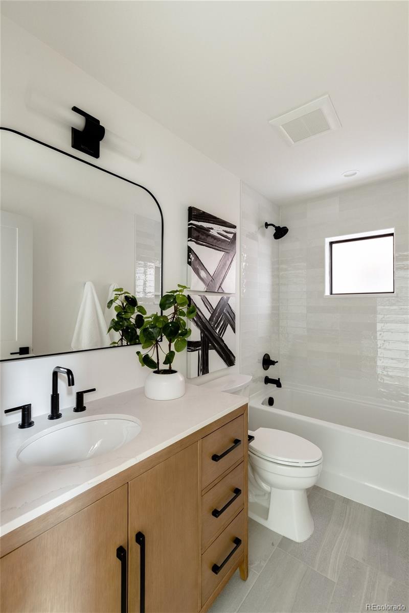 1749 North Williams Street, Unit 2 Denver, CO 80218 - Photo 30 of 34 a bathroom with a sink toilet and shower