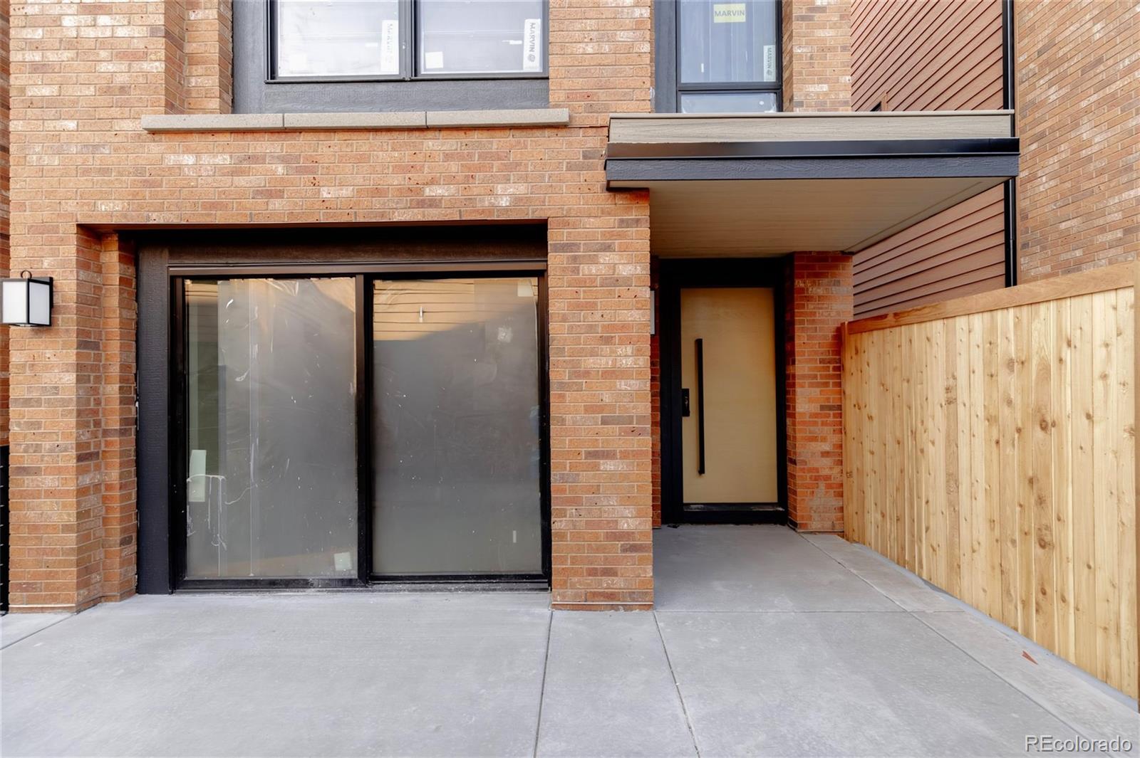 1749 North Williams Street, Unit 2 Denver, CO 80218 - Photo 3 of 34 a view of front door with wooden door