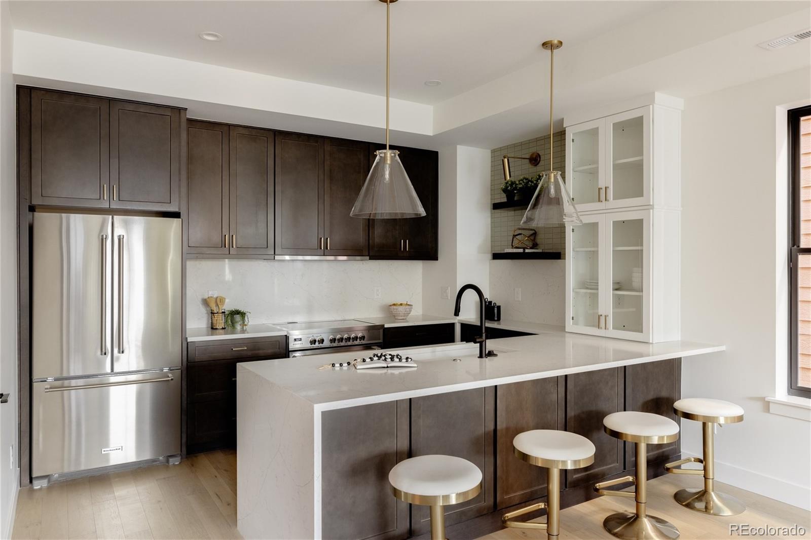 1749 North Williams Street, Unit 2 Denver, CO 80218 - Photo 7 of 34 a kitchen with a sink a refrigerator and a stove