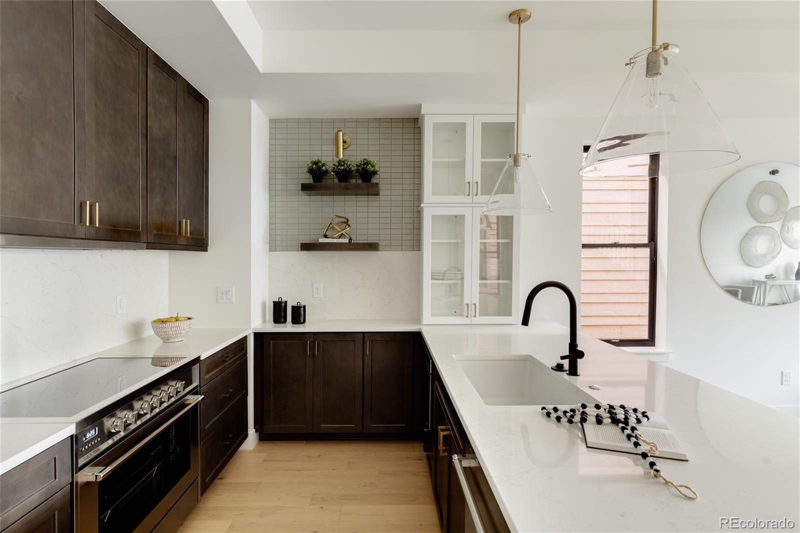 1749 North Williams Street, Unit 2 Denver, CO 80218 - Photo 9 of 34 a kitchen with a sink and stainless steel appliances