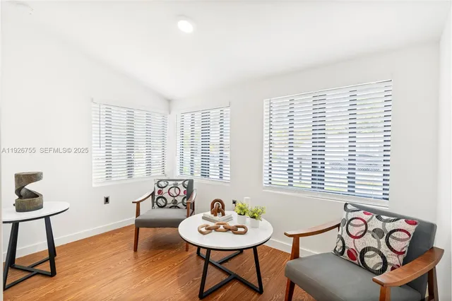 a view of a livingroom with furniture and a table