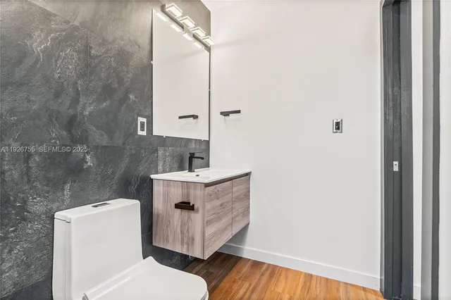 a view of bathroom with a toilet and a sink