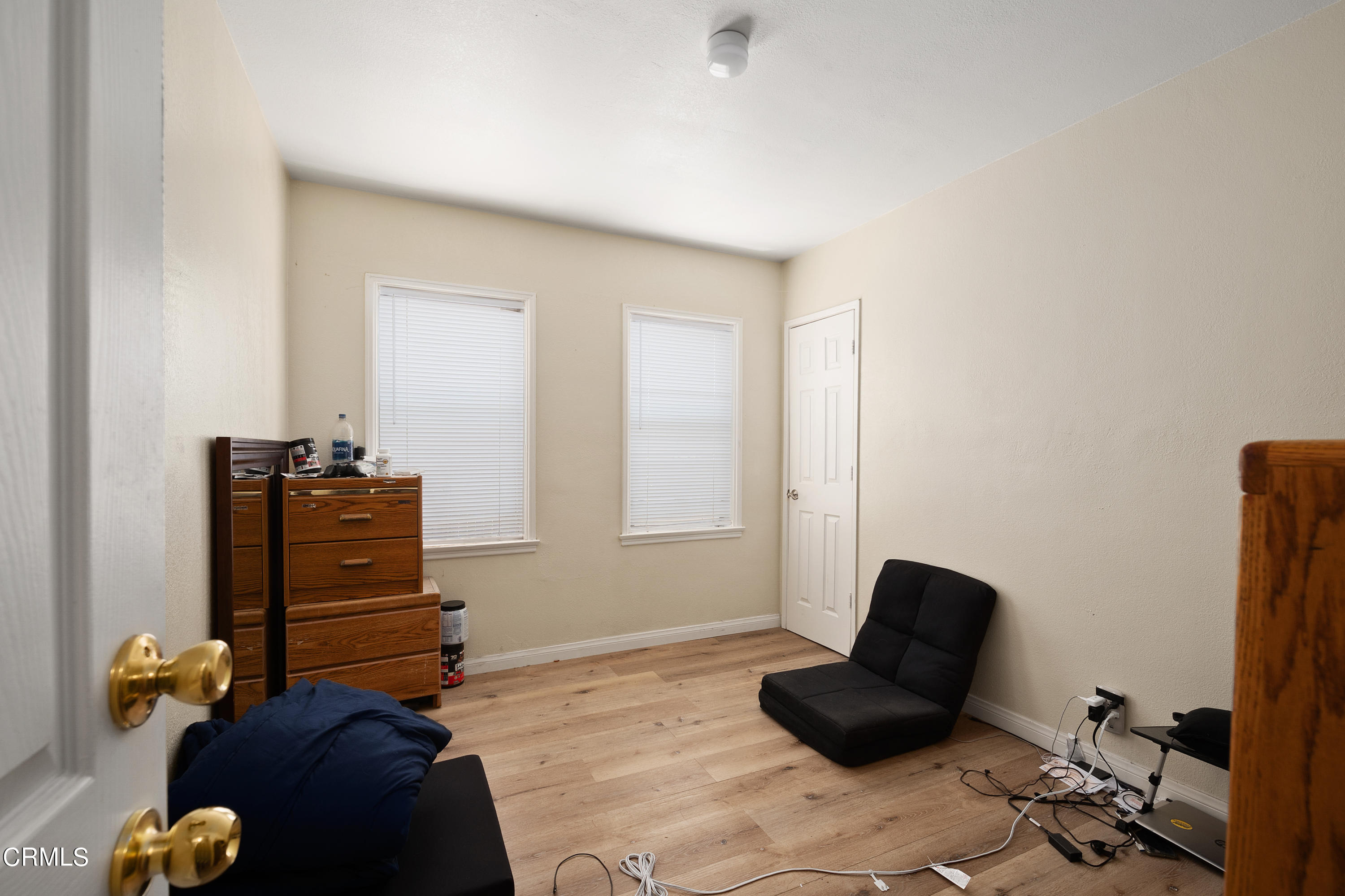 11208 Aster Street Ventura, CA 93004 - Photo 14 of 33 a living room with furniture and a closet